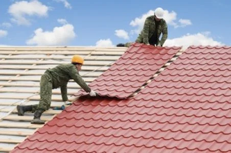 How is the insulation of the attic roof done and with what material?