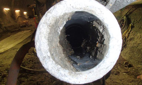 Removing plaster and cement from inside the sewer pipe